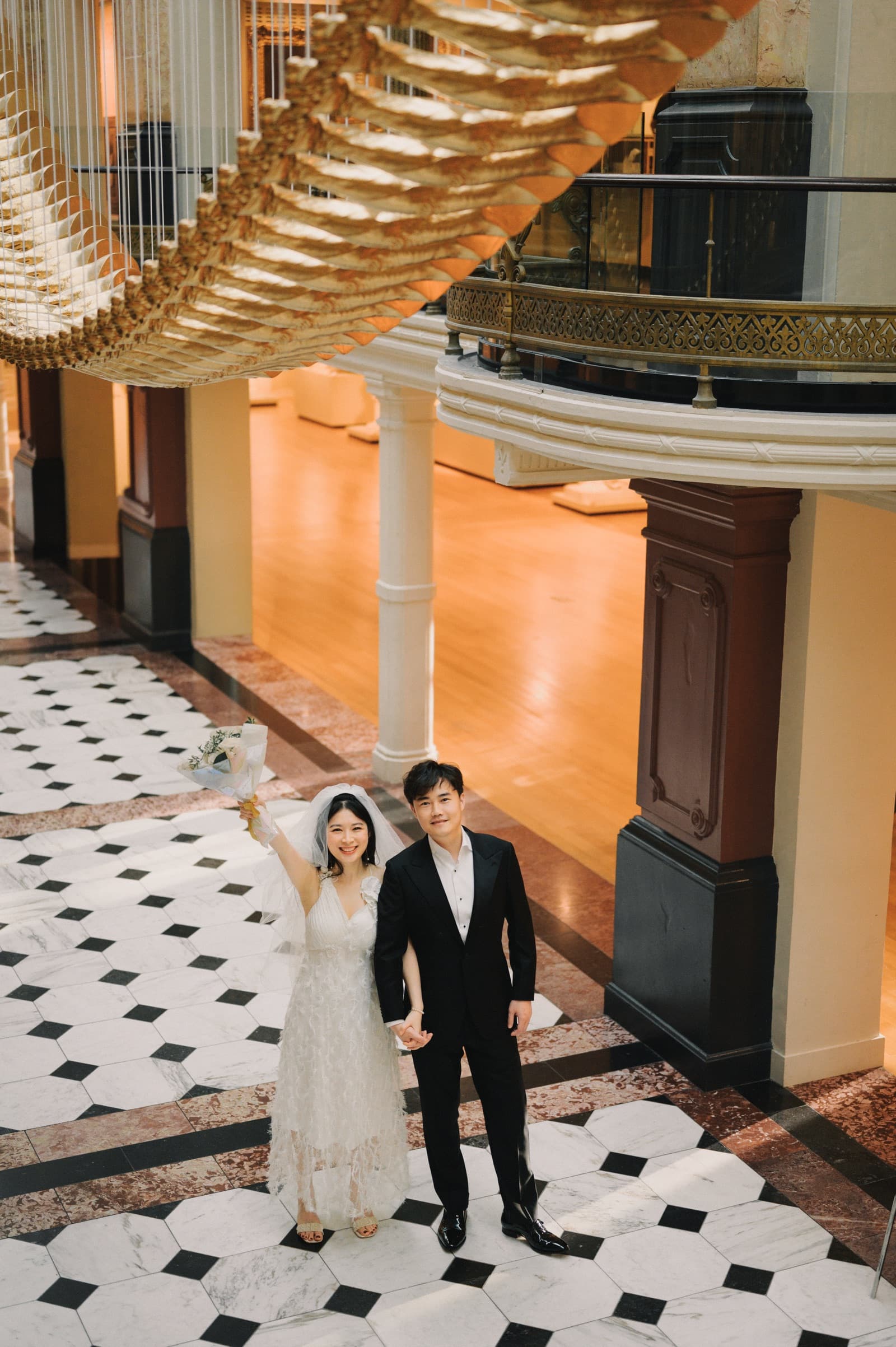 Couple in a grand marble lobby